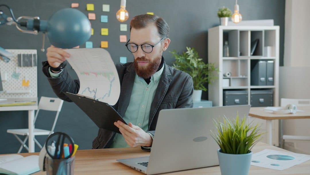 Property advisor reviewing market research and project documents