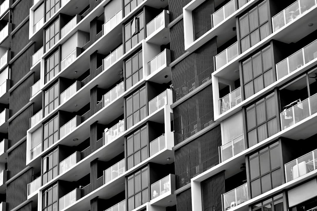 Modern condominium facade for new launch versus resale comparison